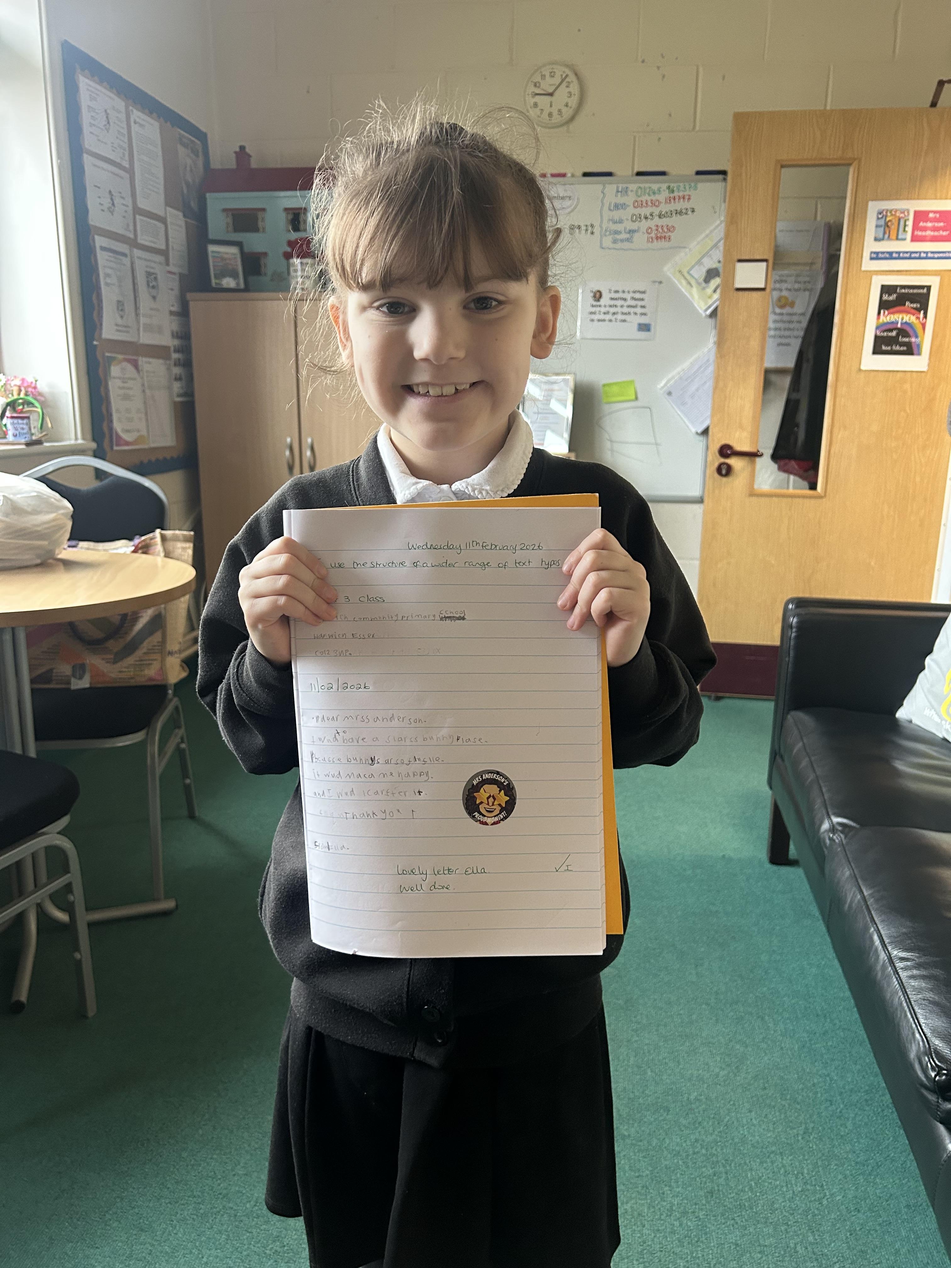 Ella is so proud of her persuasive letter. She has won her class a day with Mr Oreo.